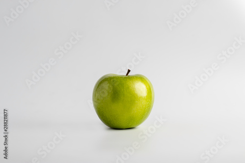 Isolated green apple over a white background
