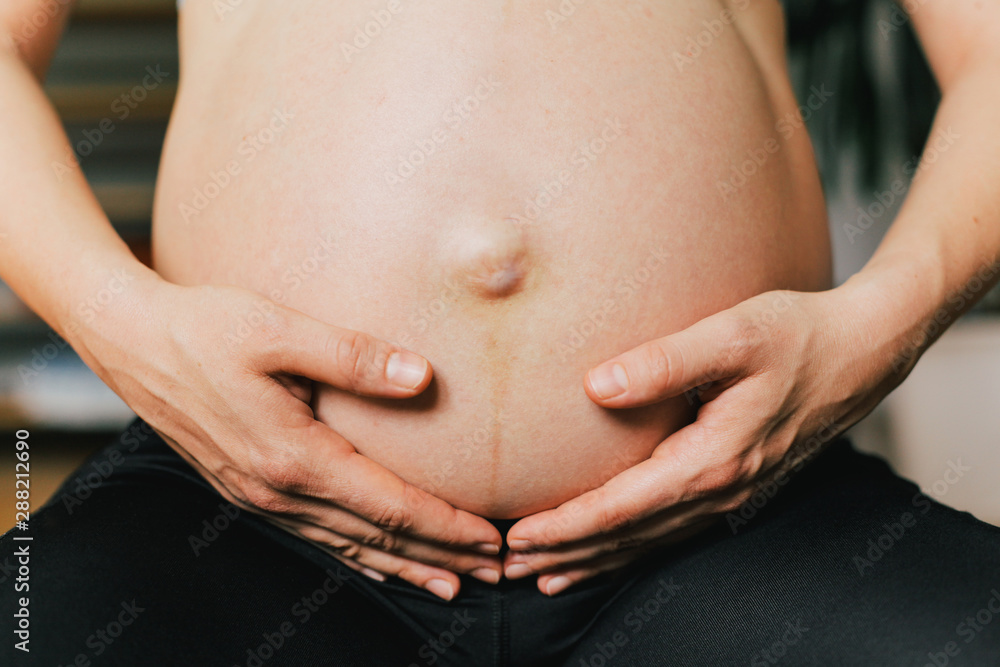 Pregnant woman practicing yoga Pregnant woman practicing yoga