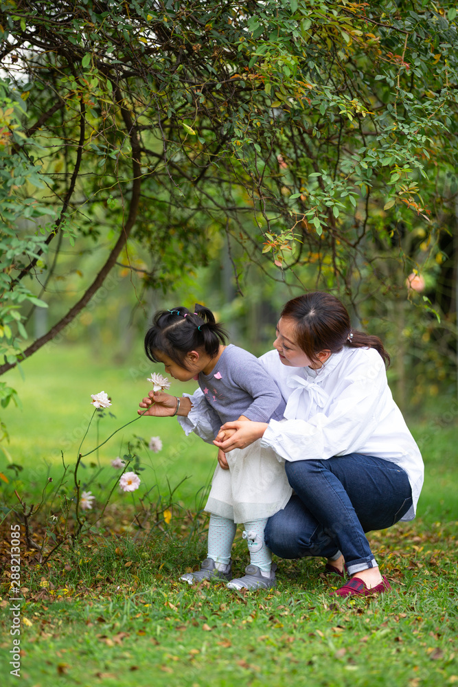 Little asian girl with her mother Little asian girl with her mother