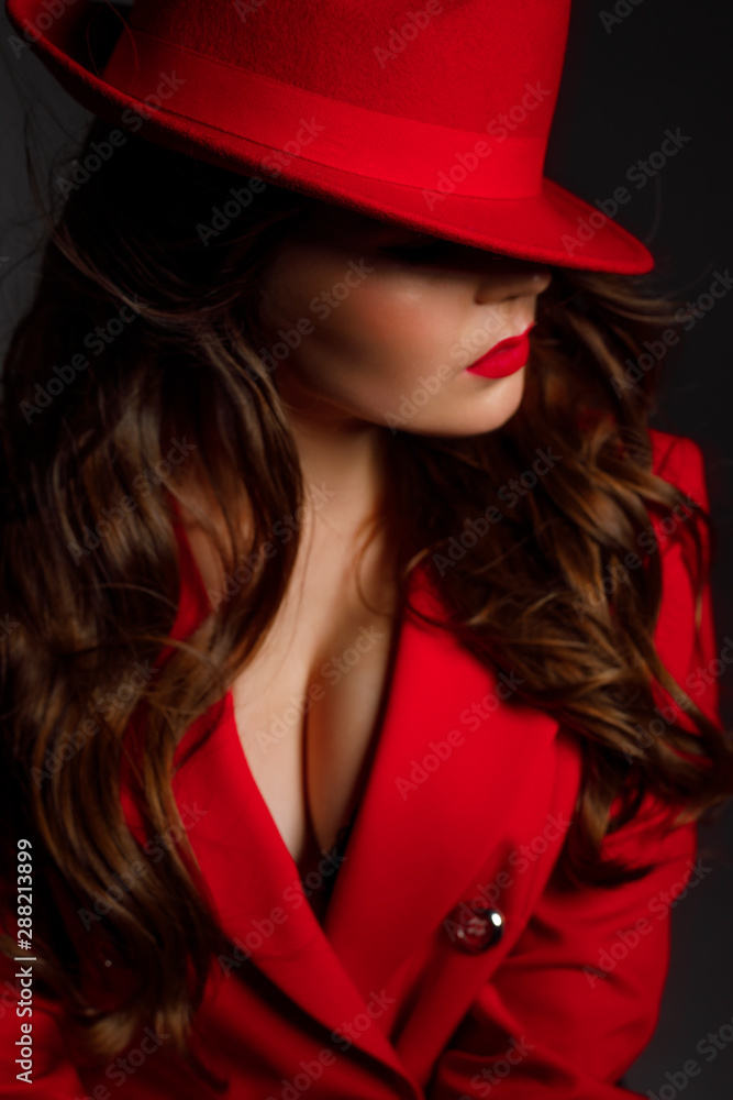 detail of a portrait of girls in a hat in front of eyes with red perfect lips, professional makeup of beautiful skin and cheekbones on a black background detail of a portrait of girls in a hat in front of eyes with red perfect lips, professional makeup of beautiful skin and cheekbones on a black background