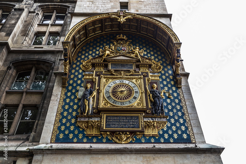 The Conciergerie and the old clock in Paris, France