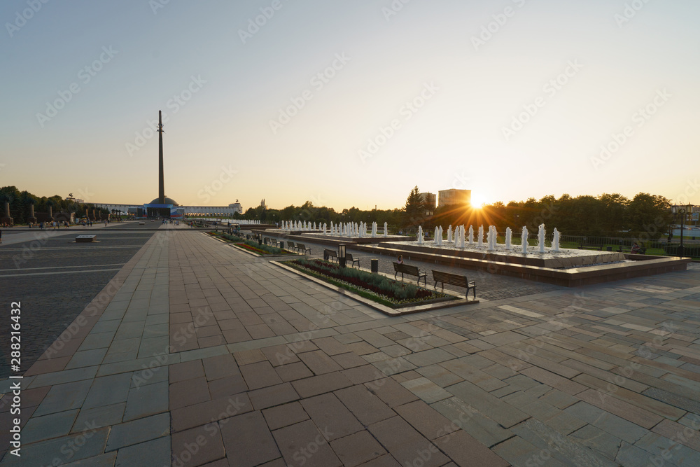 Evening Wide View of Victory Park/Park Pobedy and its fountains on Poklonnaya Hill. The city becomes calm and quiet at sunset. High angle view.