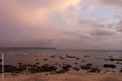 Fototapeta Naklejka Na Ścianę i Meble -  Rocky and sandy beach on Andaman islands at sunset