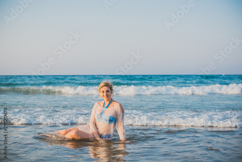 Plus size woman in holidays  Picturesque view of the beach. Vacations and adventure concept  