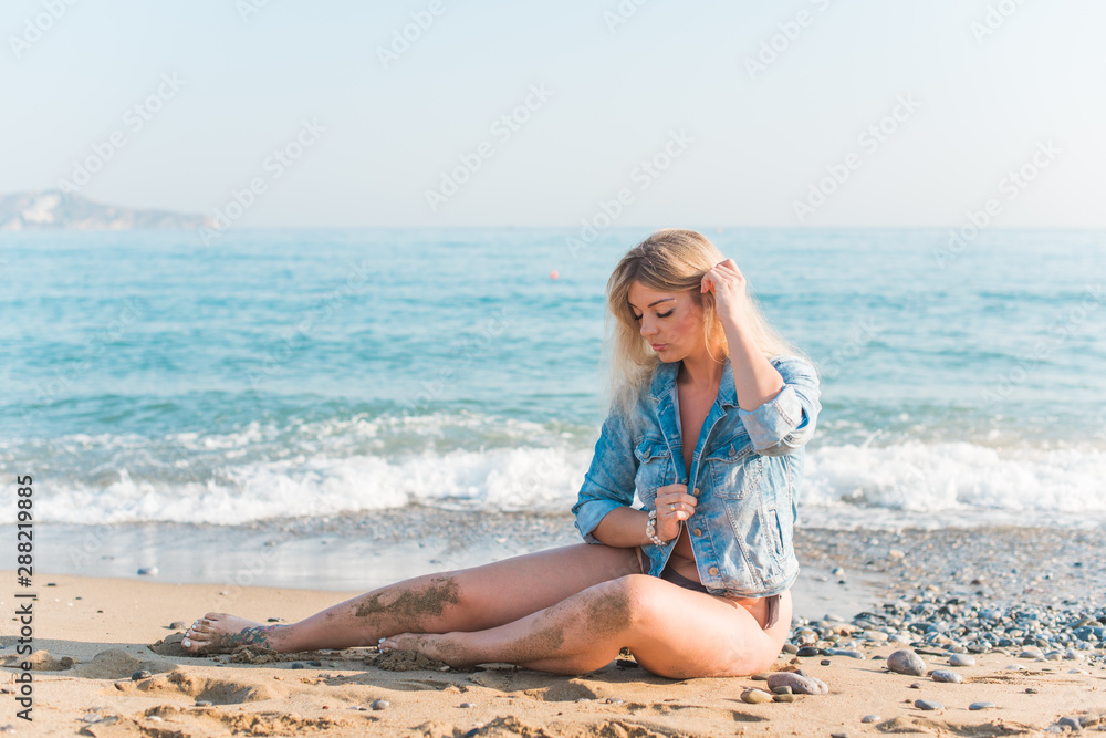 Plus size woman in holidays, Picturesque view of the beach. Vacations and adventure concept Plus size woman in holidays, Picturesque view of the beach. Vacations and adventure concept