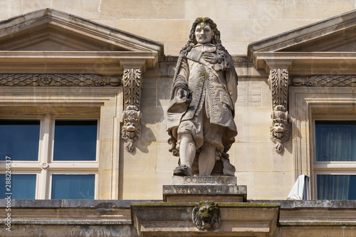 Jean-Baptiste Colbert (1619-1683) statue on the Louvre Palace, Paris, France. He was a French politician who served as the Minister of Finances of France 1661-1683 under the rule of King Louis XIV. photo