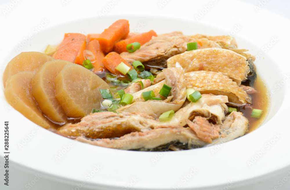 Salmon in soy source with vegetables, fish maw soup Salmon in soy source with vegetables, fish maw soup
