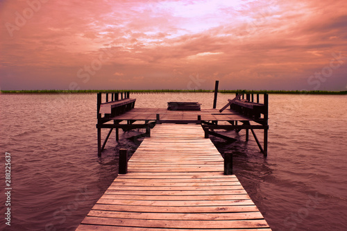 wooden pier at sunset