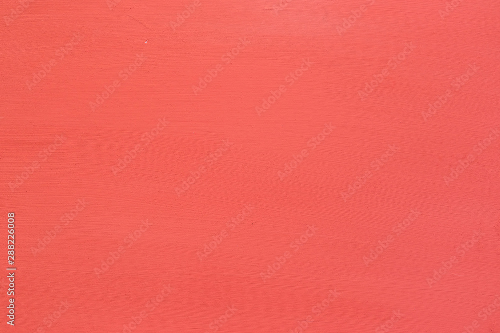 Fototapeta premium Background in the form of a wooden surface painted in coral color with textured stripes.