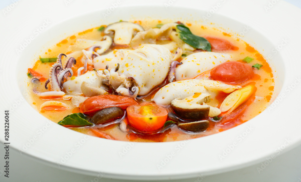Squids and lemon grass spicy soup with mushrooms, tomatoes and herbs Squids and lemon grass spicy soup with mushrooms, tomatoes and herbs