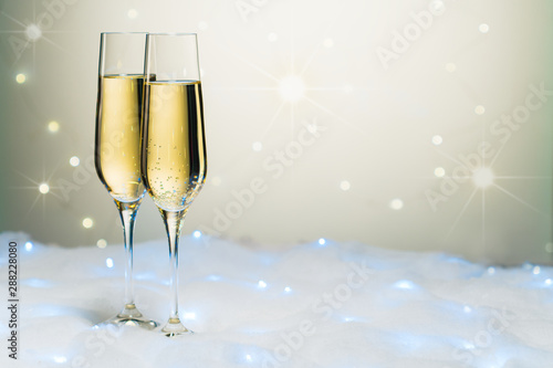 New year toast champagne, star and snow background
