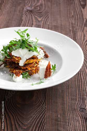 Pumpkin fritters with soft cheese and sun-dried tomato