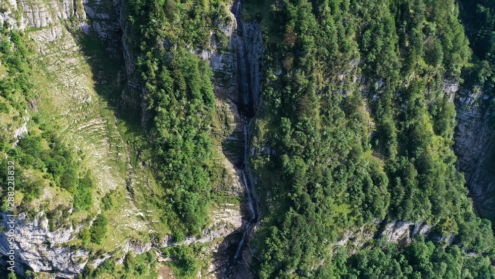 Aerial view of waterfalls in mountains, Klöntalersee lake, Glarus Kanton, Switzerland. Aerial view of waterfalls in mountains, Klöntalersee lake, Glarus Kanton, Switzerland.