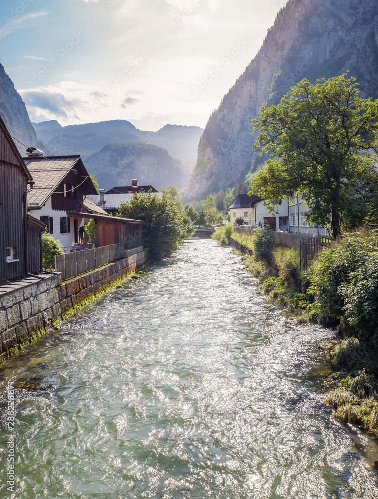 River flowing through Austrian village at sunrise. River flowing through Austrian village at sunrise.