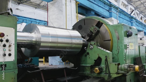 Big roll are created on the metal rolling machine at the plant. Creation of profiles. Rolling mill preparation workshop. Machining of machine parts.
