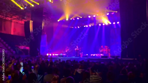 Wallpaper Mural background view people acoustic stadium night music front dance holding hand up. asian crowd back adult woman and man happy friends hipster energy vocal. concept phone arms holiday blue laser Torontodigital.ca