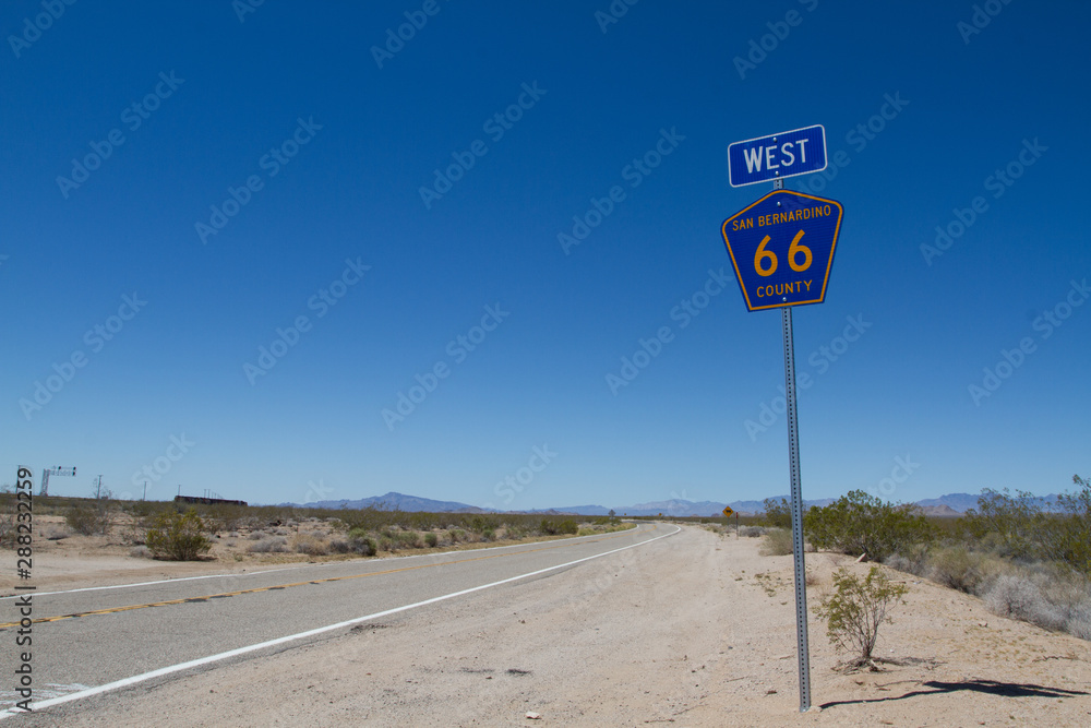 Empty road with modern Route 66 sign on the side