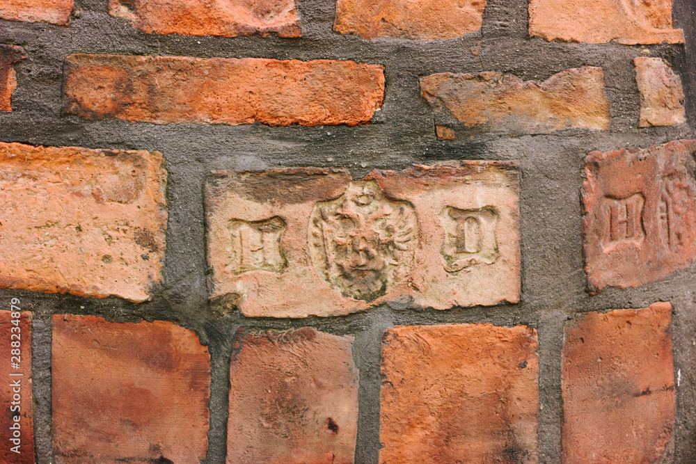 Fototapeta premium Red old bricks. Masonry. Wall texture. Close up