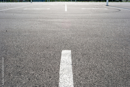 Dark asphalt road with marking lines. Tarmac texture photo