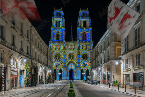 Joanna of Arc street that flows into the Church of the Holy Cross in Orleans, France. Illuminated with the technique called maping photo
