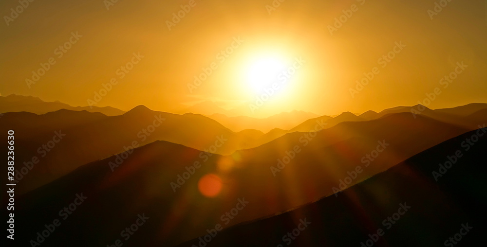 LENS FLARE: Golden morning sunbeams illuminate the stunning Himalayan landscape.