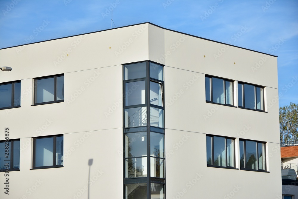 The windows of a modern building for offices. Business buildings architecture.