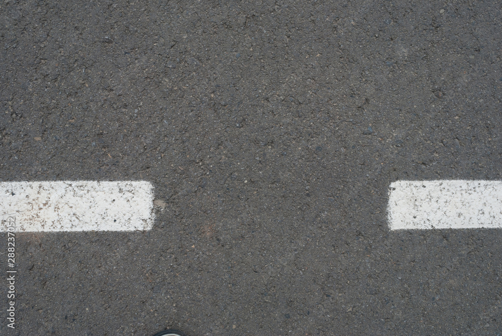 Fototapeta premium New asphalt texture with white dashed line