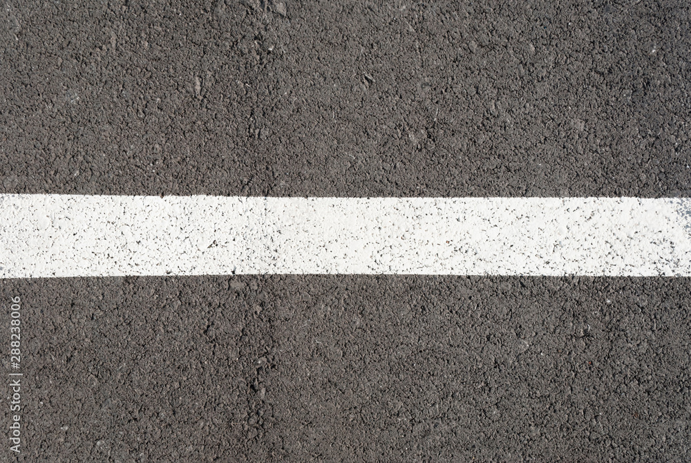 Fototapeta premium New asphalt texture with white line. Top view