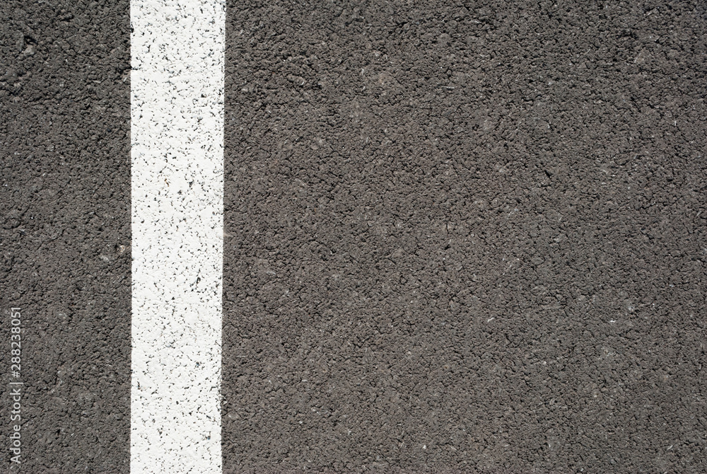 Fototapeta premium New asphalt texture with white line. Top view