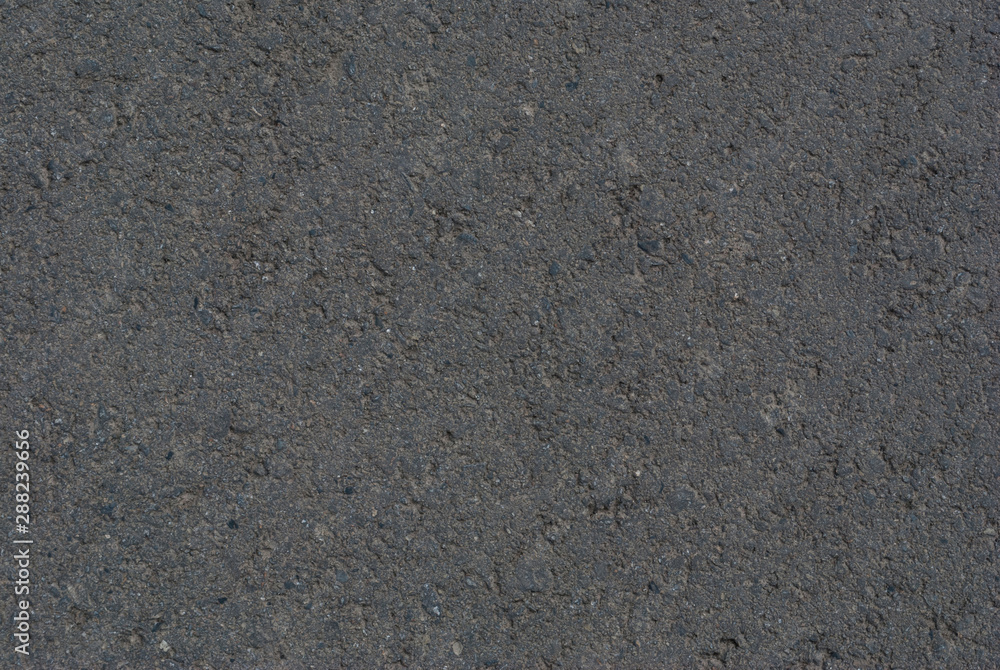 Smooth asphalt road. Tarmac dark grey grainy road background. Top view grunge rough surface Smooth asphalt road. Tarmac dark grey grainy road background. Top view grunge rough surface