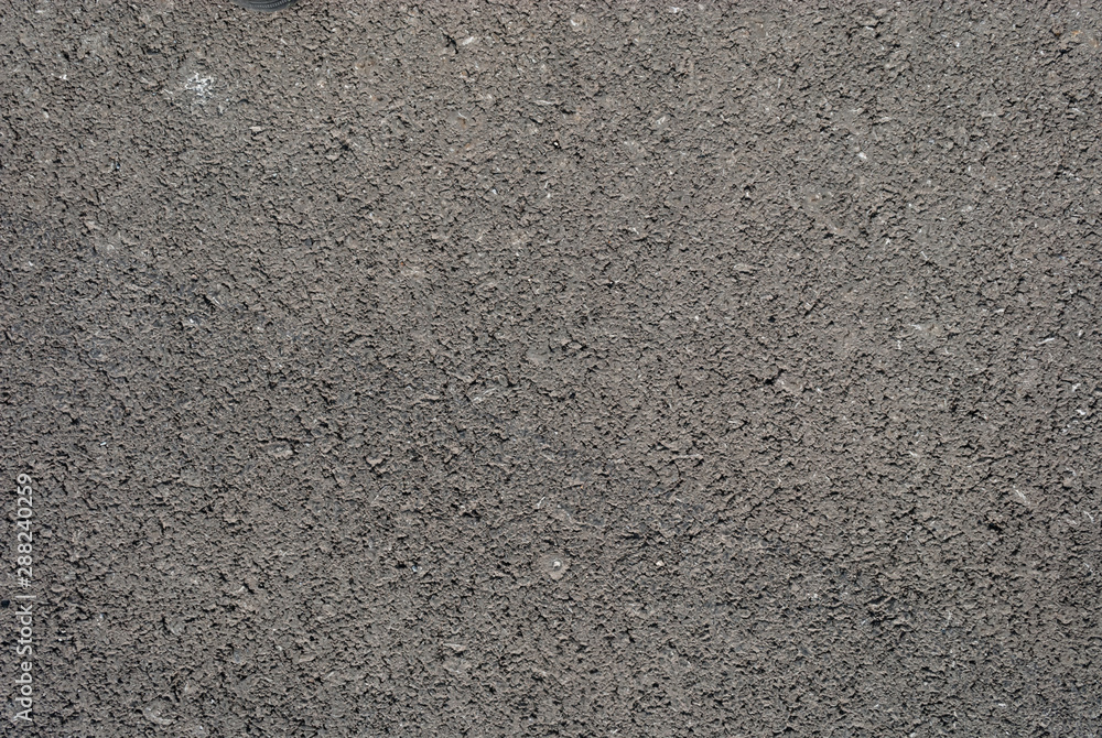 Smooth asphalt road. Tarmac dark grey grainy road background. Top view grunge rough surface Smooth asphalt road. Tarmac dark grey grainy road background. Top view grunge rough surface