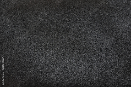 Black genuine leather texture background, surface