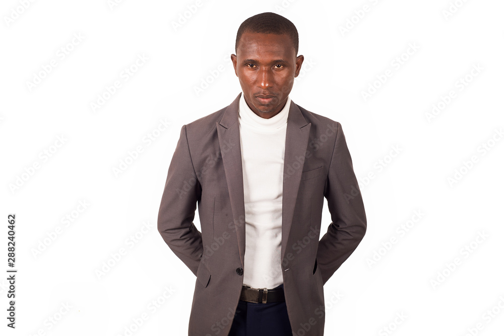 portrait of young man in a suit standing. portrait of young man in a suit standing.