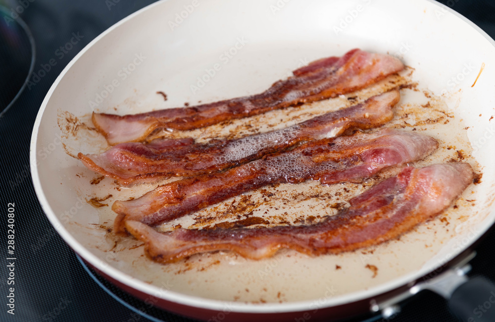 Bacon Strips Fried on Skillet Bacon Strips Fried on Skillet