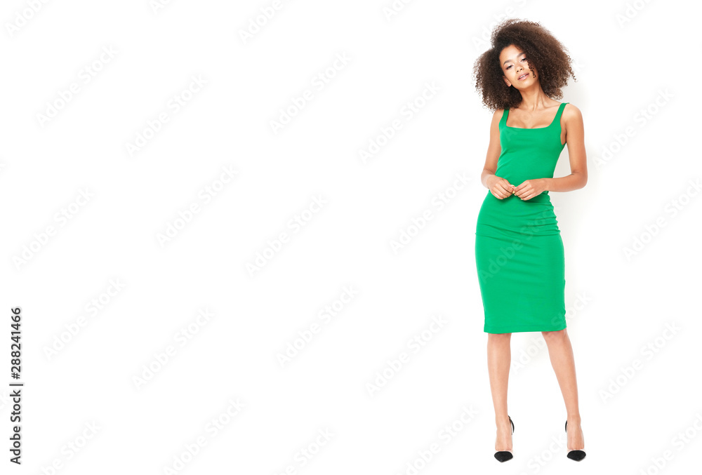 Afro american girl in tiny green dress looks gorgeous. Afro american girl in tiny green dress looks gorgeous.
