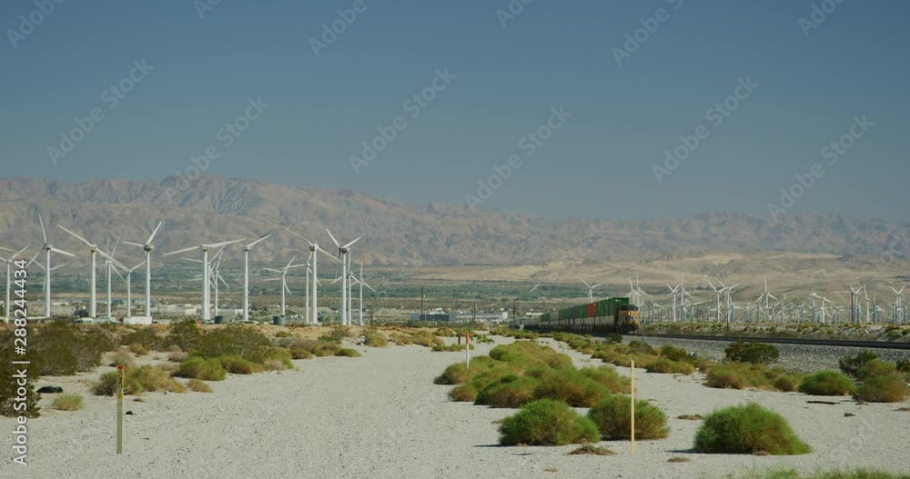 Wind turbines and cargo train in Palm Springs, California Wind turbines and cargo train in Palm Springs, California