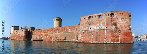 Moated Fortezza Vecchia Castle with its thick waterfront walls in Livorno, Italy photo