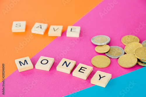 the future of Finance, business banking and financial concept. Flatlay eurocents and the word of wooden letters Save money. photo