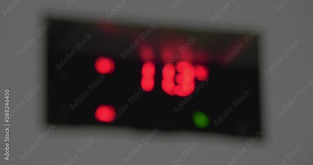 Flashing digital temperature and humidity indicator. Blurred image