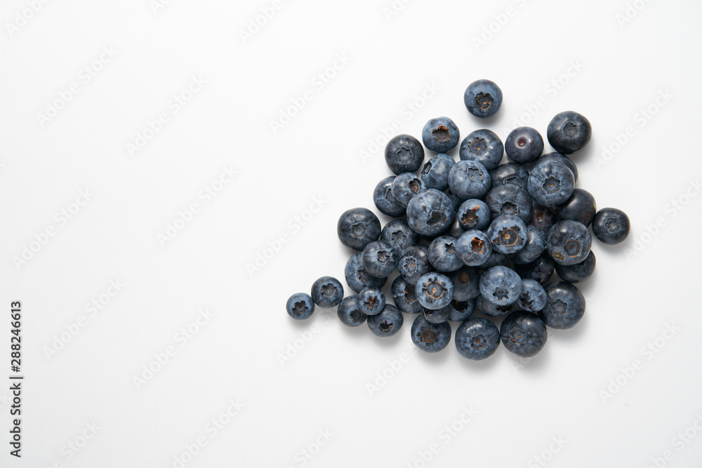 Fresh raw blueberries as background, top view. juicy blueberries on white background Fresh raw blueberries as background, top view. juicy blueberries on white background