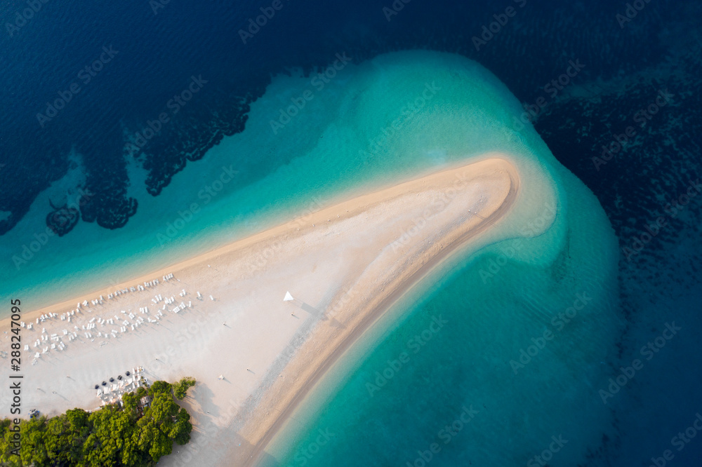 Aerial view of Zlatni Rat, Golden Cape, Brac Island, Croatia. Top view on summer beach travel in Adriatic Sea. Drone photo. Traveling concept.