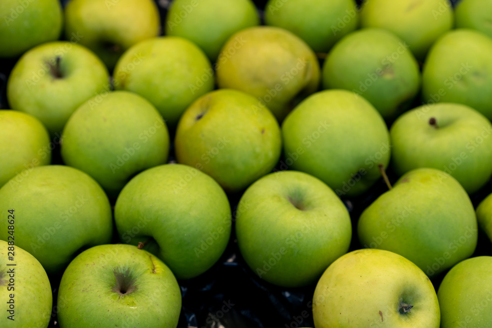 Green apples on a storefront for sale Green apples on a storefront for sale