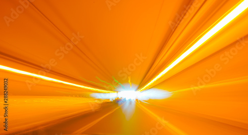 Fotografía Bright lights in motion blur whist moving towards end of a tunnel,