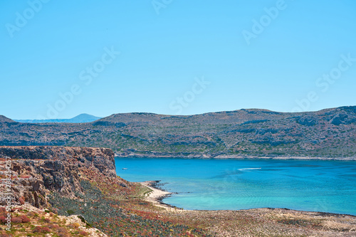  Blue lagoon with rocks on a background in Crete, Greece. Copy space.