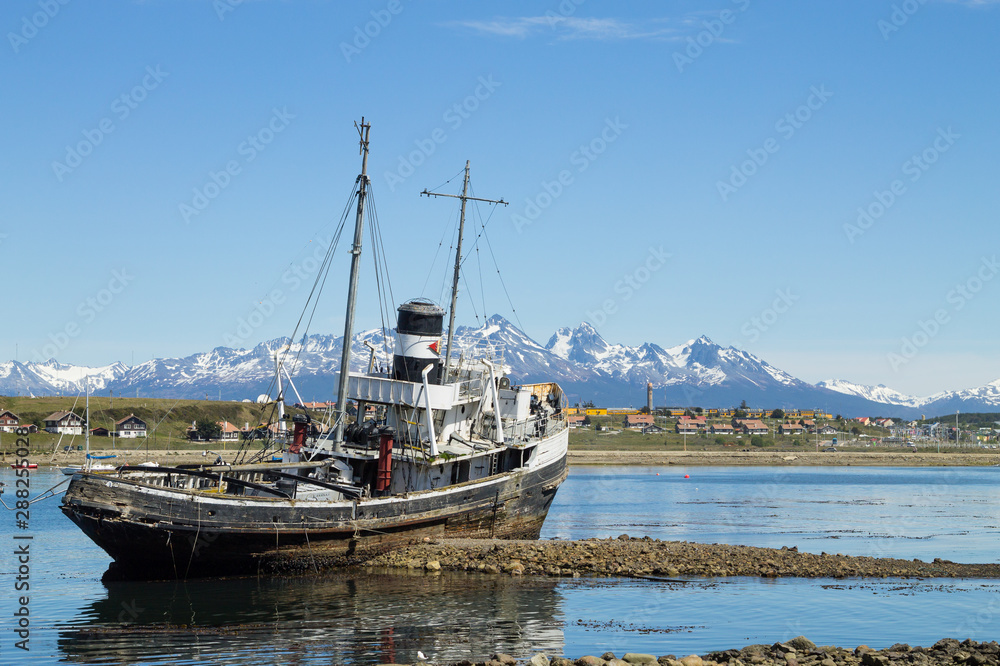 Fototapeta premium Beached ship on Ushuaia port, Argentina landscape