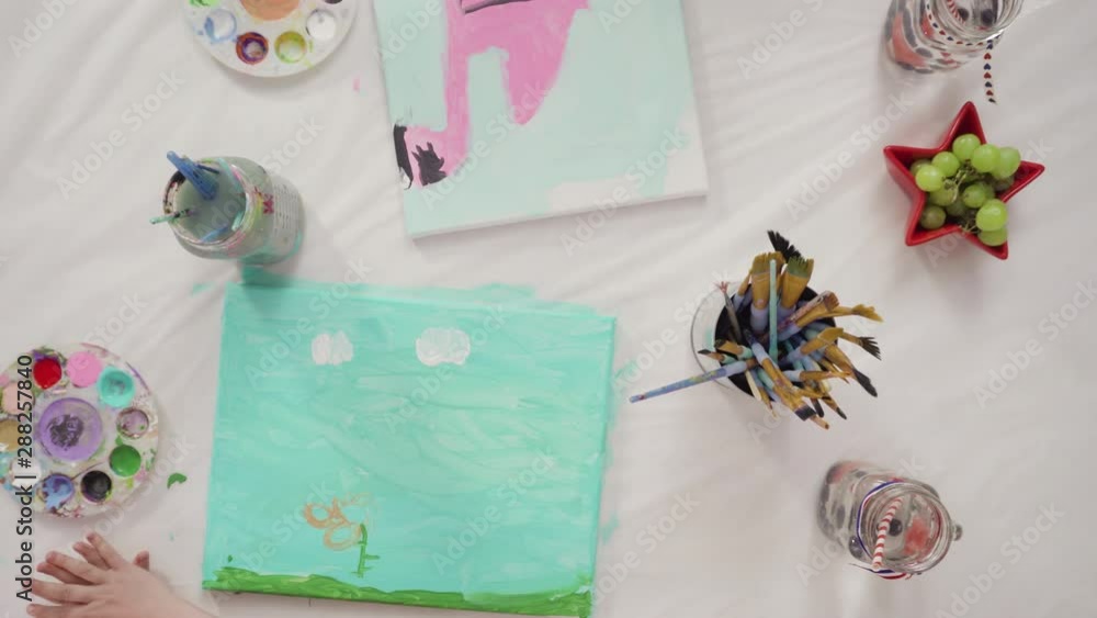 Flat lay. Little girls are painting on canvas on July 4th party. Flat lay. Little girls are painting on canvas on July 4th party.