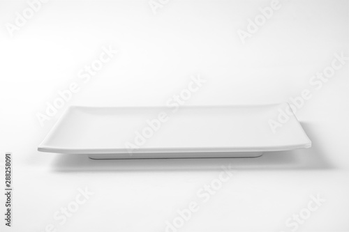 Empty  white square plate on white background.