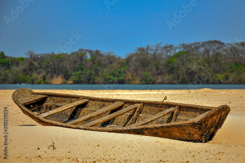 old boat on the river-beach