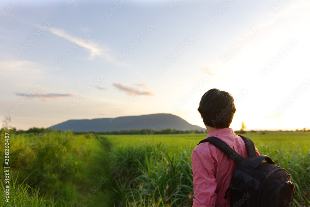 partial of man carry bag looking at the far away mountain. partial of man carry bag looking at the far away mountain.