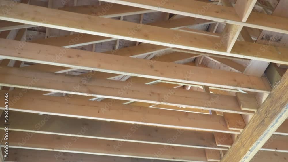 The frame of a wooden house on a unfinished object in close up a new house under contruction frame The frame of a wooden house on a unfinished object in close up a new house under contruction frame